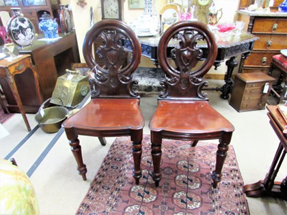 Pair of victorian mahogany hall chairs