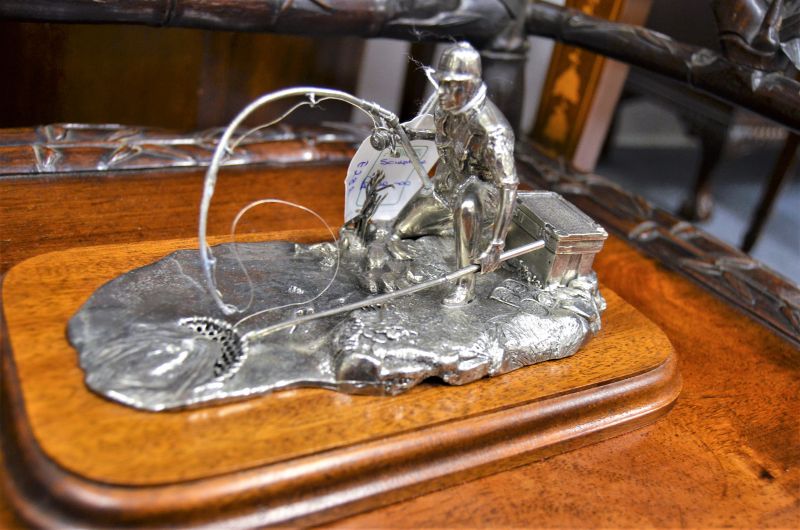 Metal sculpture of fisherman