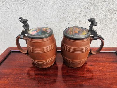 Pair of hand painted pottery tankards