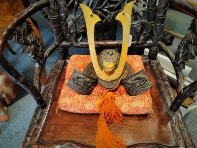 Mini japanese samurai helmet on cushion