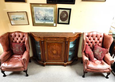 Pair of leather wing back armchairs