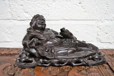 Chinese  hardwood reclining figure on stand