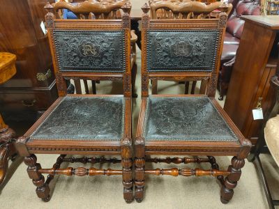 Pair of oak , leather embossed hall chairs