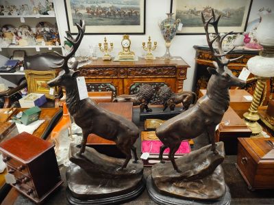 Pair of bronze stags on marble plinth bases 