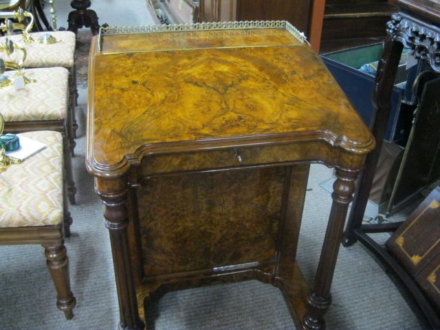A victorian burr walnut davenport