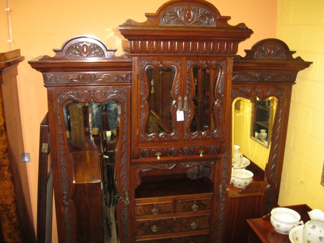 A large mahogany robe, dated 1900