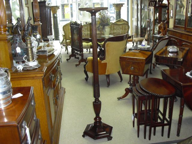 A mahogany torchiere.
