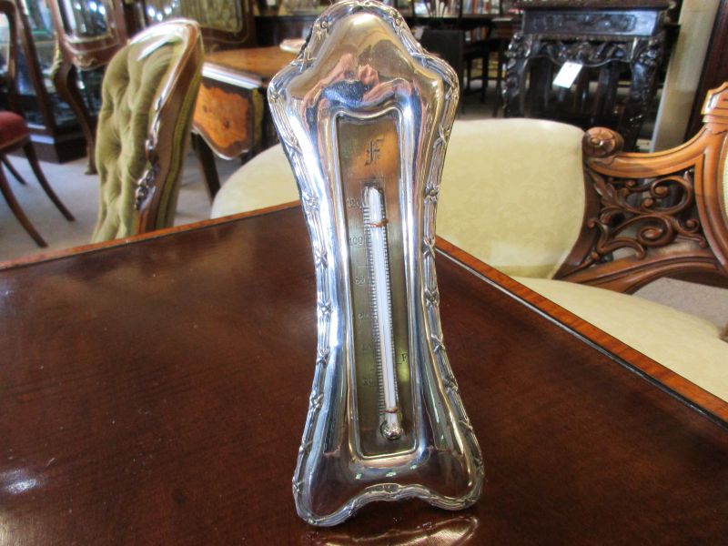 Silver framed barometer
