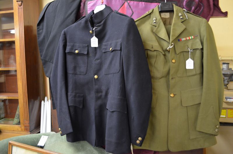 Selection of old military uniforms & hats