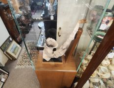 saxaphone plaster sculpture in glass display case Thumbnail 4